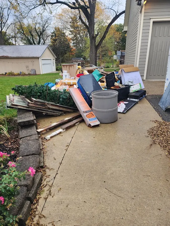 Dumpster being loaded with debris for Commercial Dumpster Rental in West Jordan